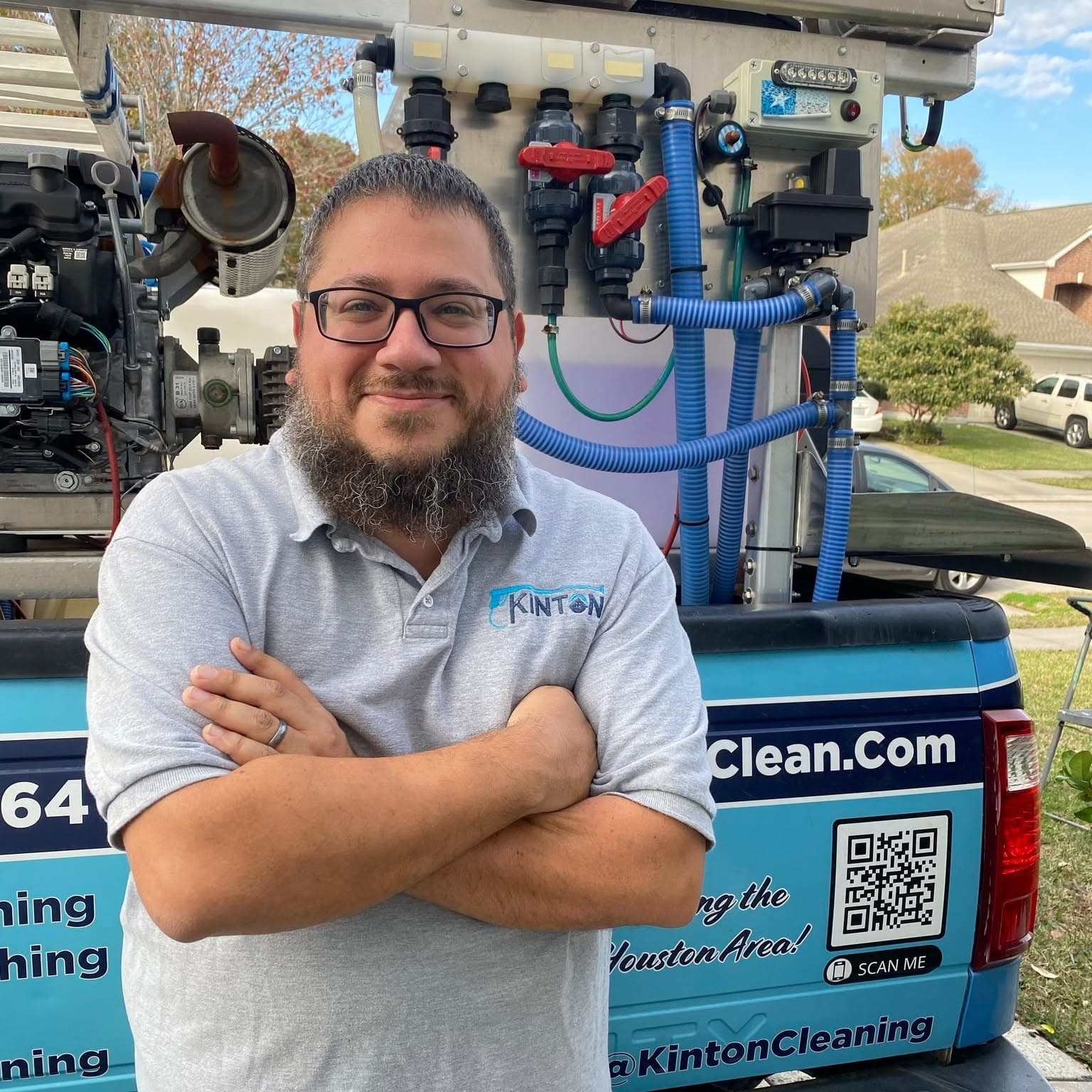 Curtis McMinn standing beside Kinton Pressure Washing equipment